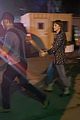dakota-johnson-chris-martin-holding-hands