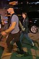 dakota-johnson-chris-martin-holding-hands